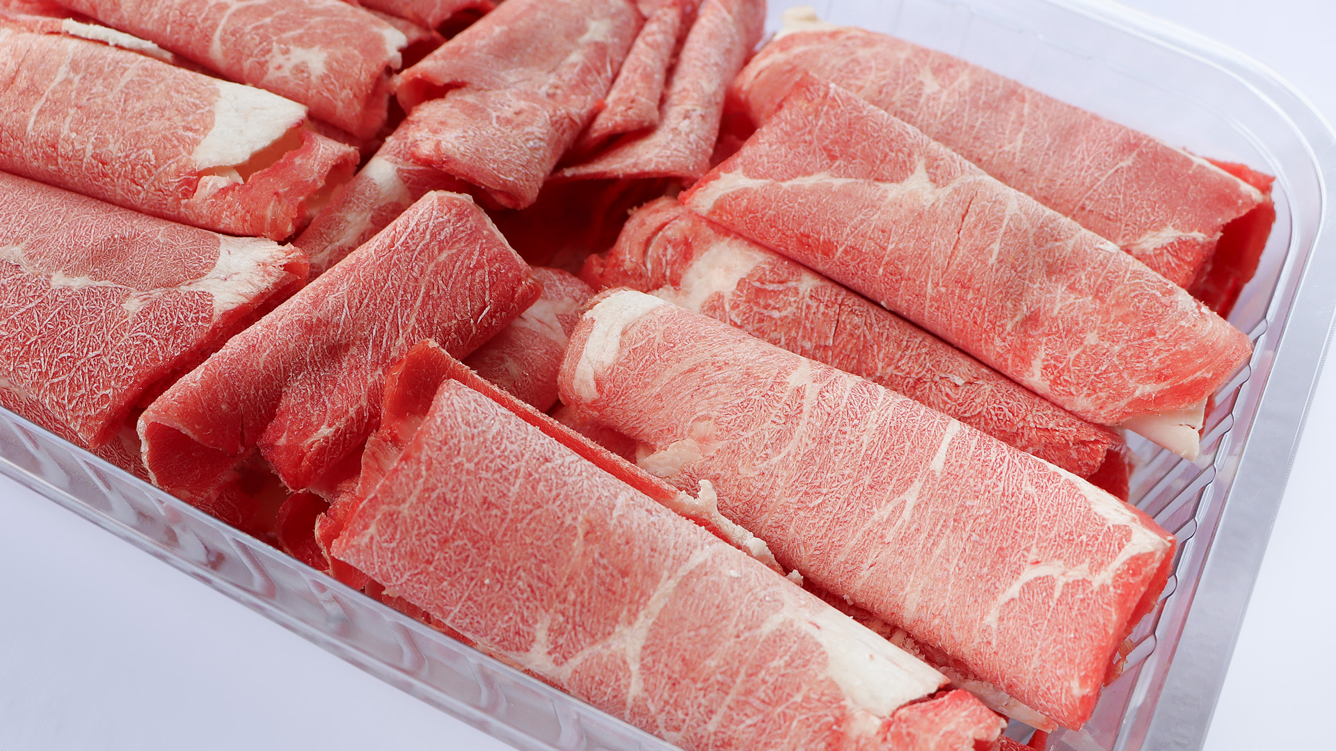 Close-up of premium sliced beef rolls
